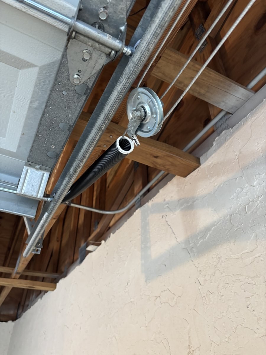 Overhead pulley and lift cable on an extension spring door